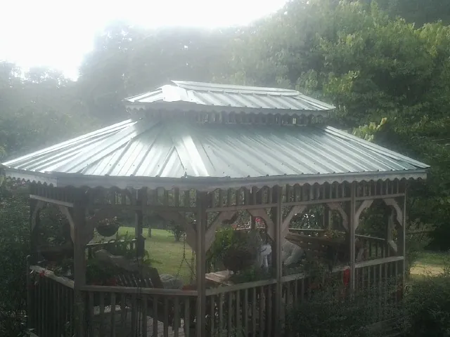 Two tier green metal roof on a garden gazebo in Hot Springs Village